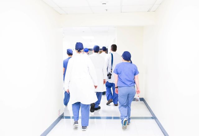 Healthcare workers walking down a hallway
