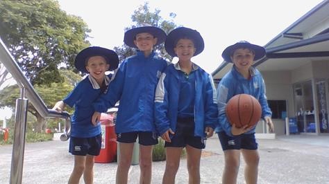 Picture of 4 friends from Nudgee College with a basketball.