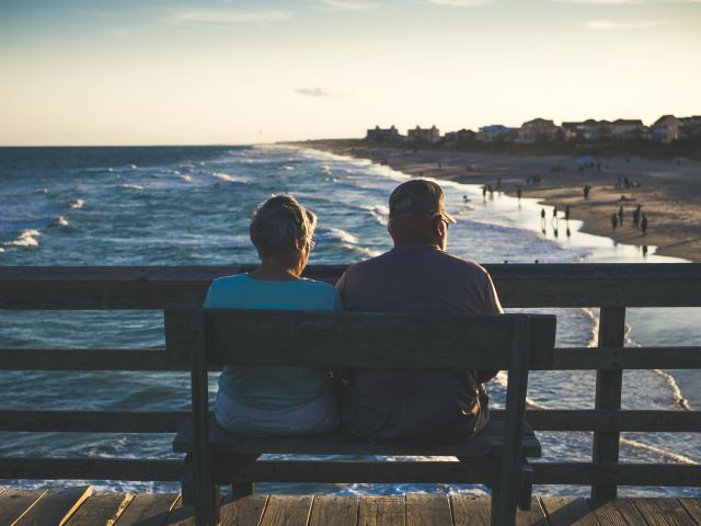 Older couple looking out at the ocean