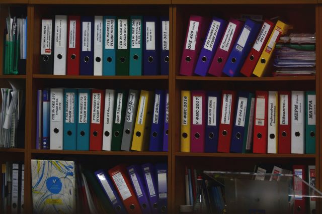 Image of shelves with folders on them